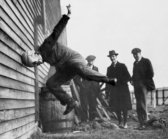 Man testing a prototype football helmet 1912