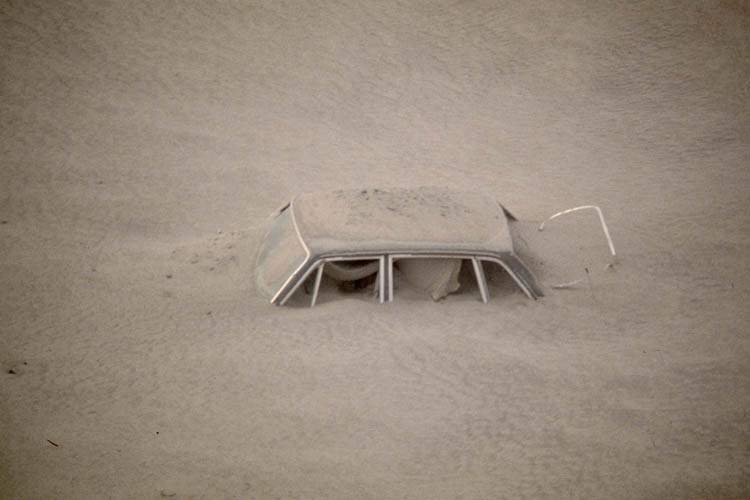 A Car Submerged in Ash