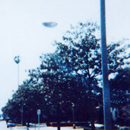UFO Flies Over City Street