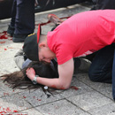 Man comforts an injured woman