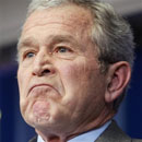 President Bush reacts to a reporter's question