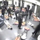 Photo: Caught on camera: 40 prison guards kick and punch juvenile inmates... already handcuffed