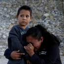 Guatemalan mother begging soldier to let her enter U.S.