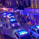 Photo: New Orleans police clear out bustling Bourbon Street after governor bans gatherings of over 250 people