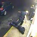Photo: Disturbing Video Catches Cop Severely Beat Restrained Man & Threaten Him With Gun to His Head
