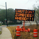 Photo: Hacked road signs warn of zombies, raptors ahead